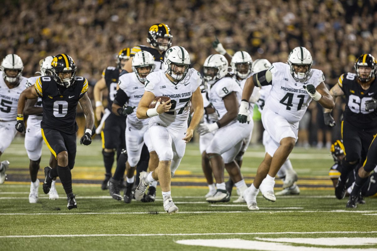 Michigan State linebacker Cal Haladay carries the ball after recovering a fumble during a football game between Iowa and Michigan State at Kinnick Stadium on Saturday, Sept. 30, 2023. The Hawkeyes defeated the Spartans, 26-16. Haladay had three solo tackles and a touchdown.