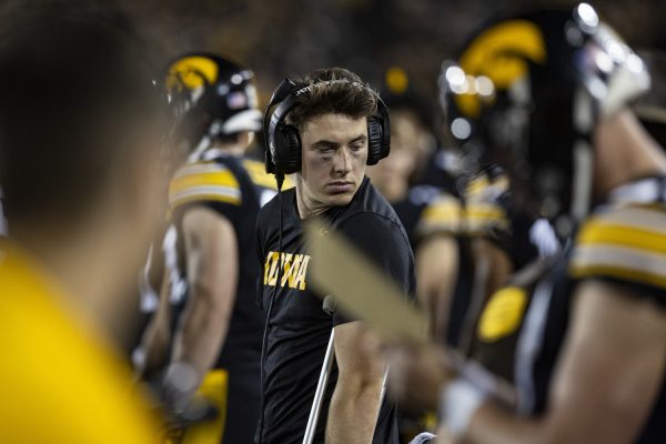 Iowa quarterback Cade McNamara stands on the sidelines with crutches after getting injured in the first quarter during a football game between Iowa and Michigan State at Kinnick Stadium on Saturday, Sept. 30, 2023. The Hawkeyes defeated the Spartans, 26-16.