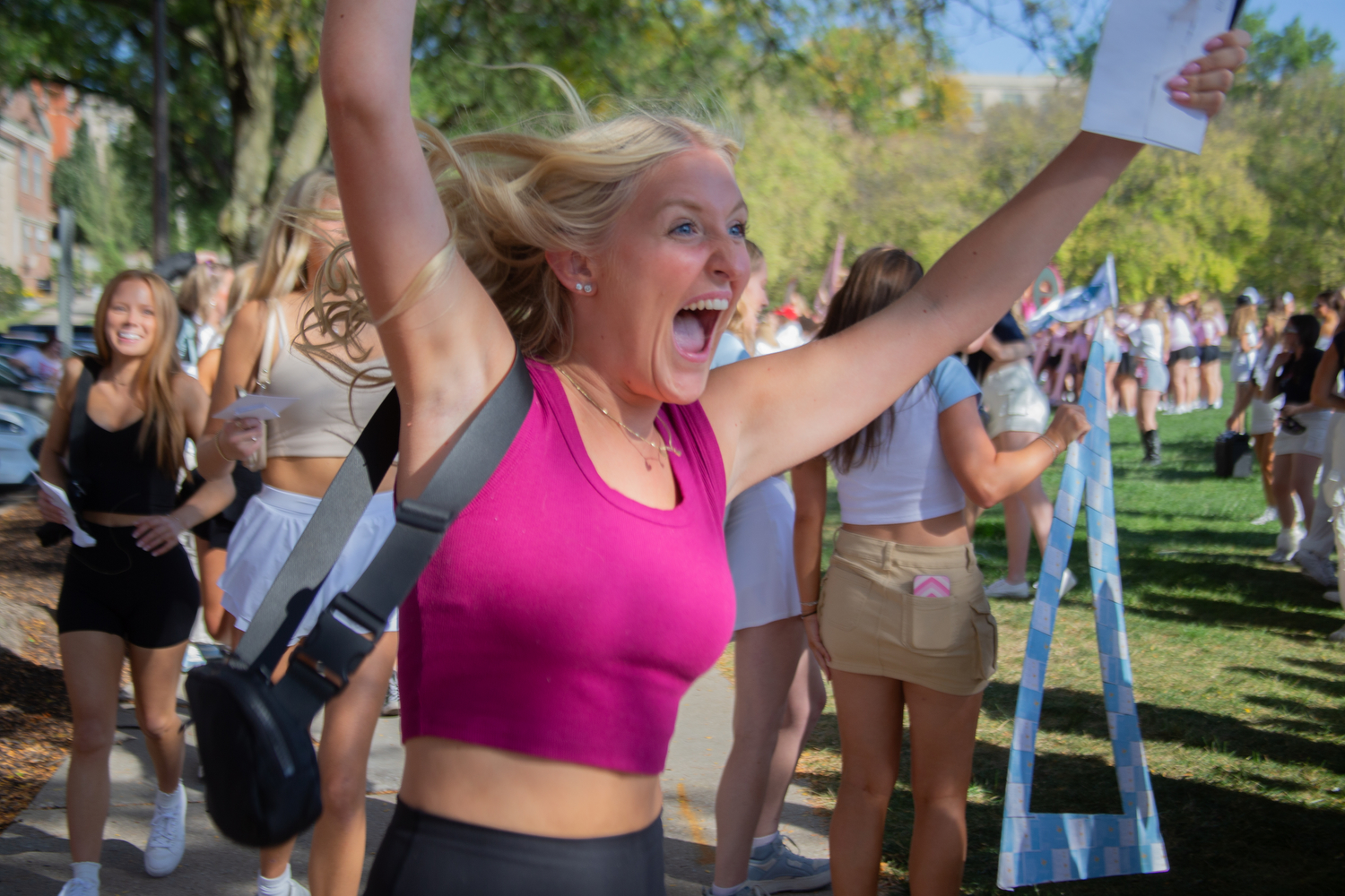 A potential new member runs to a sorority during the University of Iowa’s Bid Day in the Iowa Memorial Union and Hubbard Park in Iowa City on Sunday, Oct. 1, 2023. The potential new members accepted their bids.