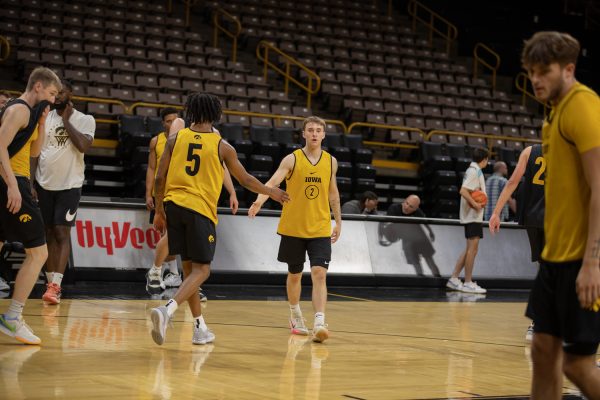 Iowa guards Brock Harding and Davonte Bowen high-five during the 2023 Men’s Basketball media day at Carver-Hawkeye Arena on Monday Oct. 2, 2023.