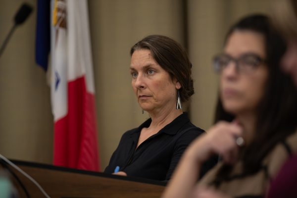 Laura Bergus listens to public comment during the Iowa City City Council meeting in Iowa City on Tuesday, Oct. 3, 2023. 