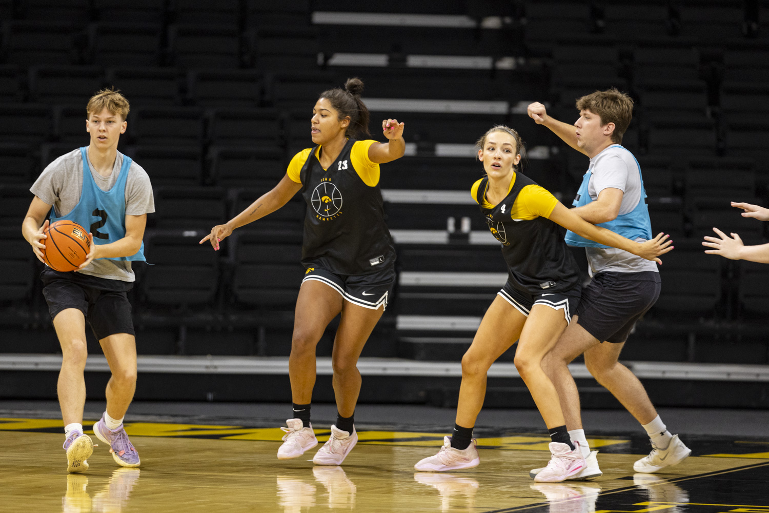 Iowa forward Jada Gyamfi and guard Kylie Feuerbach run a drill during Iowa women's basketball media day at Carver-Hawkeye Arena on Wednesday, Oct. 4, 2023. Iowa finished runner-up in the 2023 NCAA women’s national championship. (Ayrton Breckenridge/The Daily Iowan)