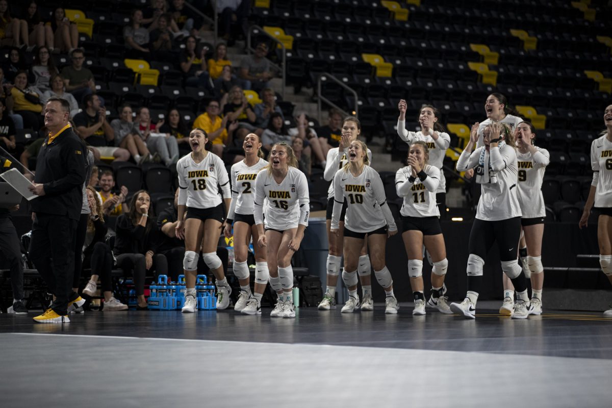 Members of the Iowa volleyball team celebrates during a volleyball match between Iowa and Wisconsin at Xtreme Arena in Coralville on Wednesday, Oct. 4, 2023. The Badgers defeated the Hawkeyes, 3-0.