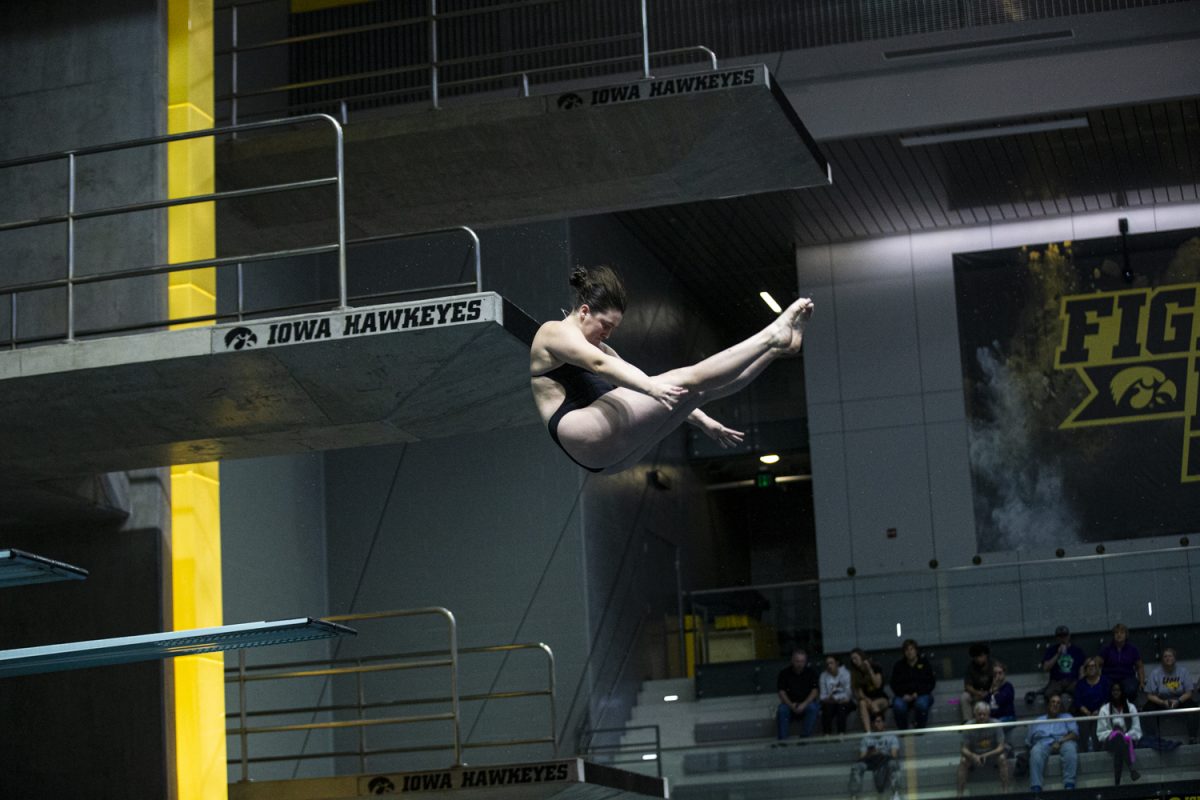 Iowa’s Simone Beinlich does a trick off the 3 meter diving board during a swim meet between Iowa and Northern Iowa at the Campus Recreation and Wellness Center on Friday, Oct. 6, 2023. The Hawkeyes defeated the Panthers 196.5-103.5. Beinlich placed first off the 3 meter diving board with a score of 262.30.