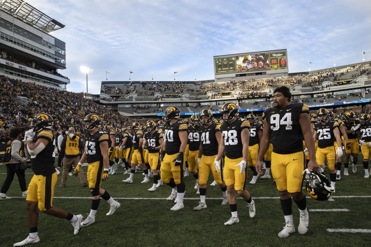Iowa football players walk off the field after the Iowa homecoming football game between Iowa and Purdue at Kinnick Stadium in Iowa City on Saturday, Oct. 7, 2023. The Hawkeyes defeated the Boilermakers 20-14.