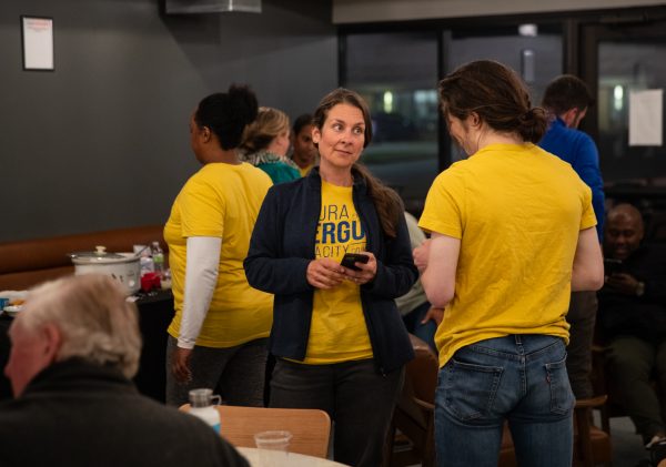 Laura Bergus and her supporters wait for the Iowa City Council primary results to come in while gathering at an election watch party at the South District Market in Iowa City on Tuesday, Oct. 10, 2023. 