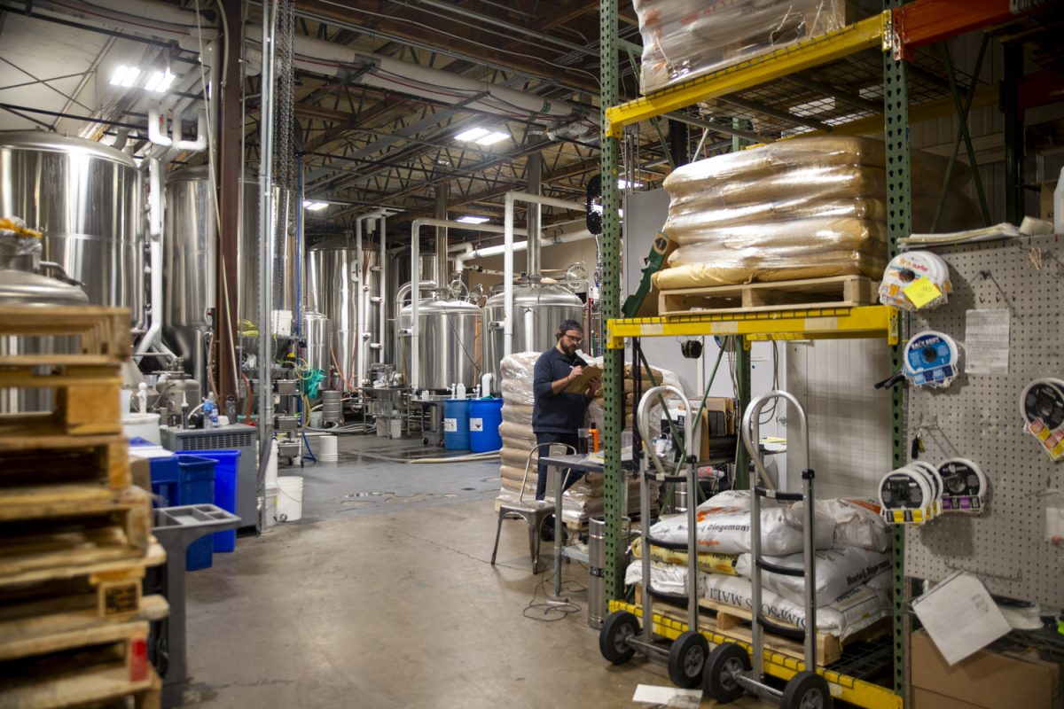 A Big Grove employee works in the taproom at Big Grove Brewery & Taproom on Wednesday, Oct. 11, 2023.