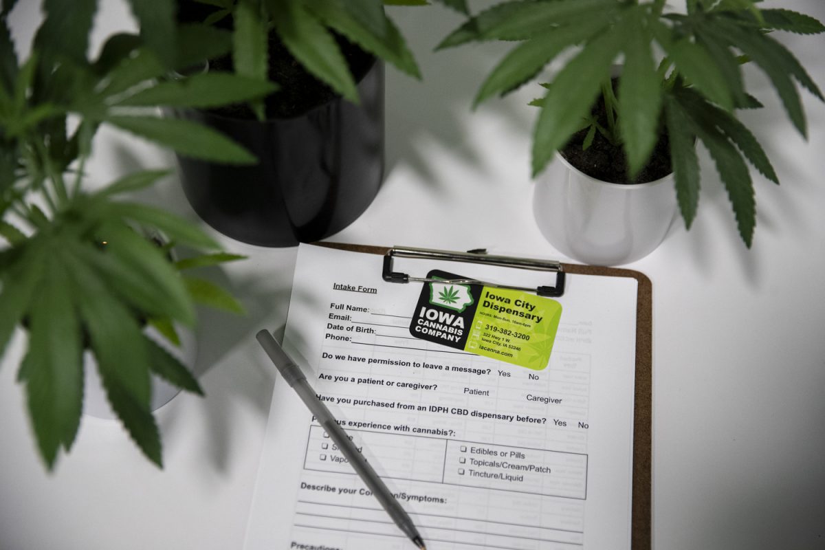 An intake form and Iowa City Dispensary card seen in Iowa City on Friday, Oct. 13, 2023. The Iowa Cannabis Company was founded in 2018 and distributes THC and CBD products for medicinal use to any qualifying Iowans.