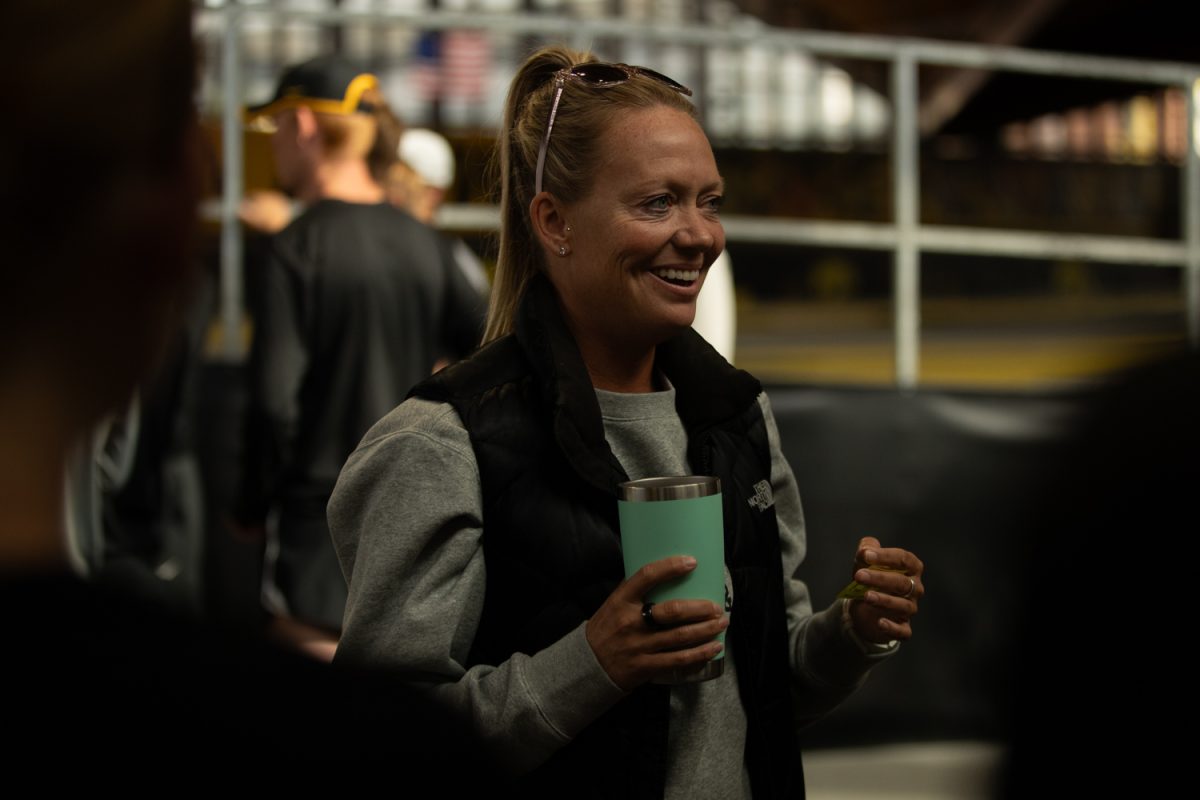 Coach Shayla Houlihan is seen coaching the track team at Jacobson indoor track facility on Oct. 11, 2023. It’s coach Houlihan’s first time coaching the Big Ten Championship  and postseason. 