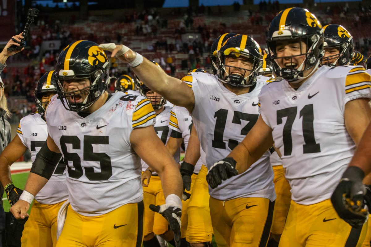 Iowa players walk off the field after a football game between Iowa and Wisconsin at Camp Randall Stadium in Madison, Wisconsin on Saturday, Oct. 14, 2023. The Hawkeyes defeated the Badgers 15-6.