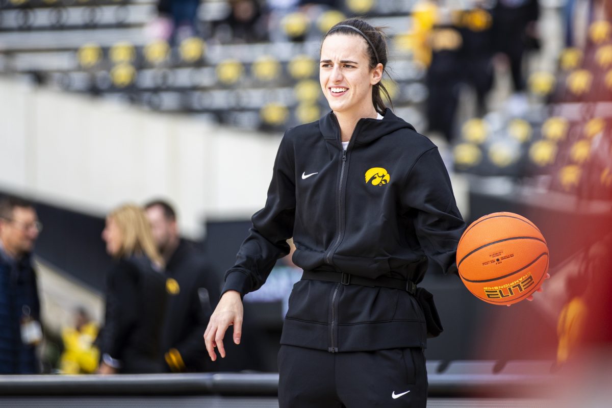 Iowa guard Caitlin Clark warms up before Crossover at Kinnick, a women’s exhibition basketball game between Iowa and DePaul, at Kinnick Stadium in Iowa City on Sunday, Oct. 15, 2023. The Hawkeyes enter the 2023-24 season after advancing to the NCAA Championship for the first time in program history last year and winning a program-best 31 games in a single season in the 2022-23 season.