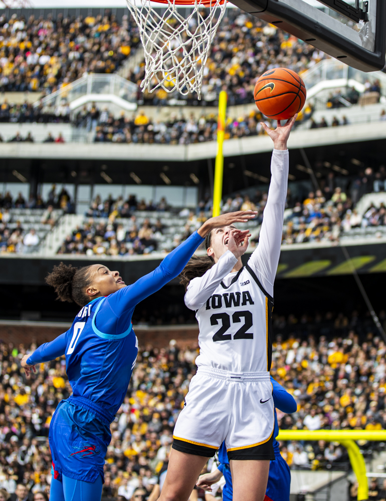 Iowa guard Caitlin Clark shoots the ball during Crossover at Kinnick, a women’s exhibition basketball game between Iowa and DePaul, at Kinnick Stadium in Iowa City on Sunday, Oct. 15, 2023. The Hawkeyes enter the 2023-24 season after advancing to the NCAA Championship for the first time in program history last year and winning a program-best 31 games in a single season in the 2022-23 season. (Grace Smith/The Daily Iowan)