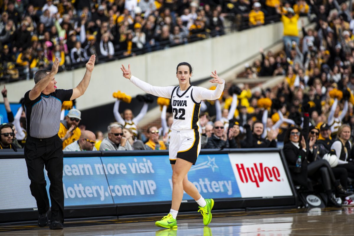 Iowa guard Caitlin Clark celebrates a three-pointer during Crossover at Kinnick, a women’s exhibition basketball game between Iowa and DePaul, at Kinnick Stadium in Iowa City on Sunday, Oct. 15, 2023. The Hawkeyes enter the 2023-24 season after advancing to the NCAA Championship for the first time in program history last year and winning a program-best 31 games in a single season in the 2022-23 season.