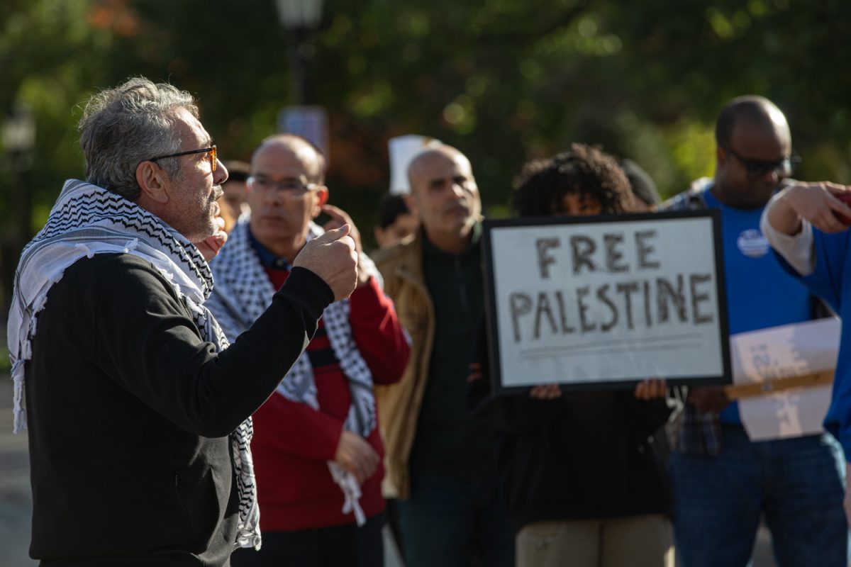 Newman Abuissa, chair of the Arab American Caucus, with the Iowa Democratic Party speaks his mind to event goers. Pro-Palestine protesters demonstrated at the Old Capital in Iowa City on Sunday, Oct. 15, 2023. 