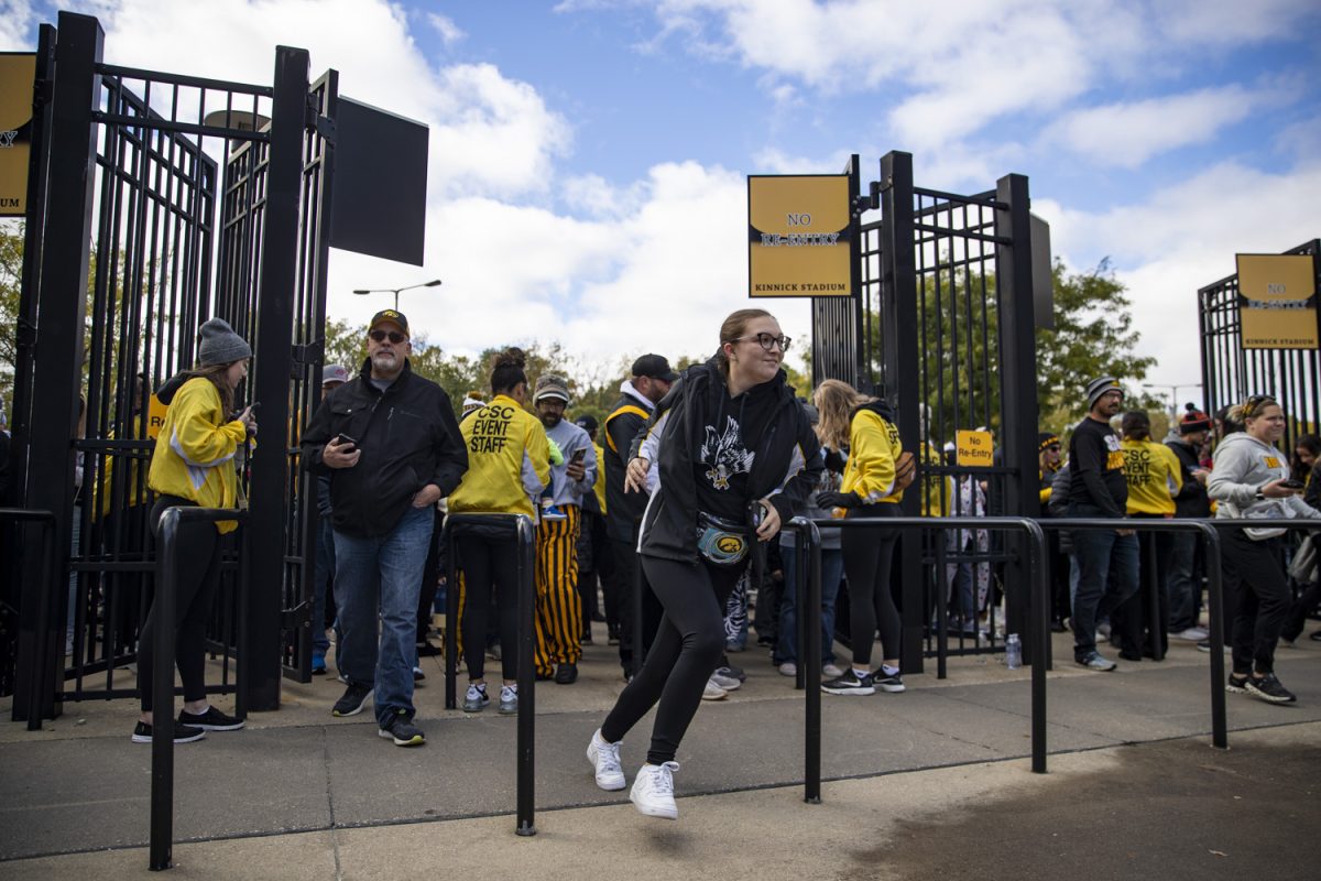 Fans pass through the ticket gate before Crossover at Kinnick, a women’s exhibition basketball game between Iowa and DePaul, at Kinnick Stadium in Iowa City on Sunday, Oct. 15, 2023. The Hawkeyes enter the 2023-24 season after advancing to the NCAA Championship for the first time in program history last year and winning a program-best 31 games in a single season in the 2022-23 season. 