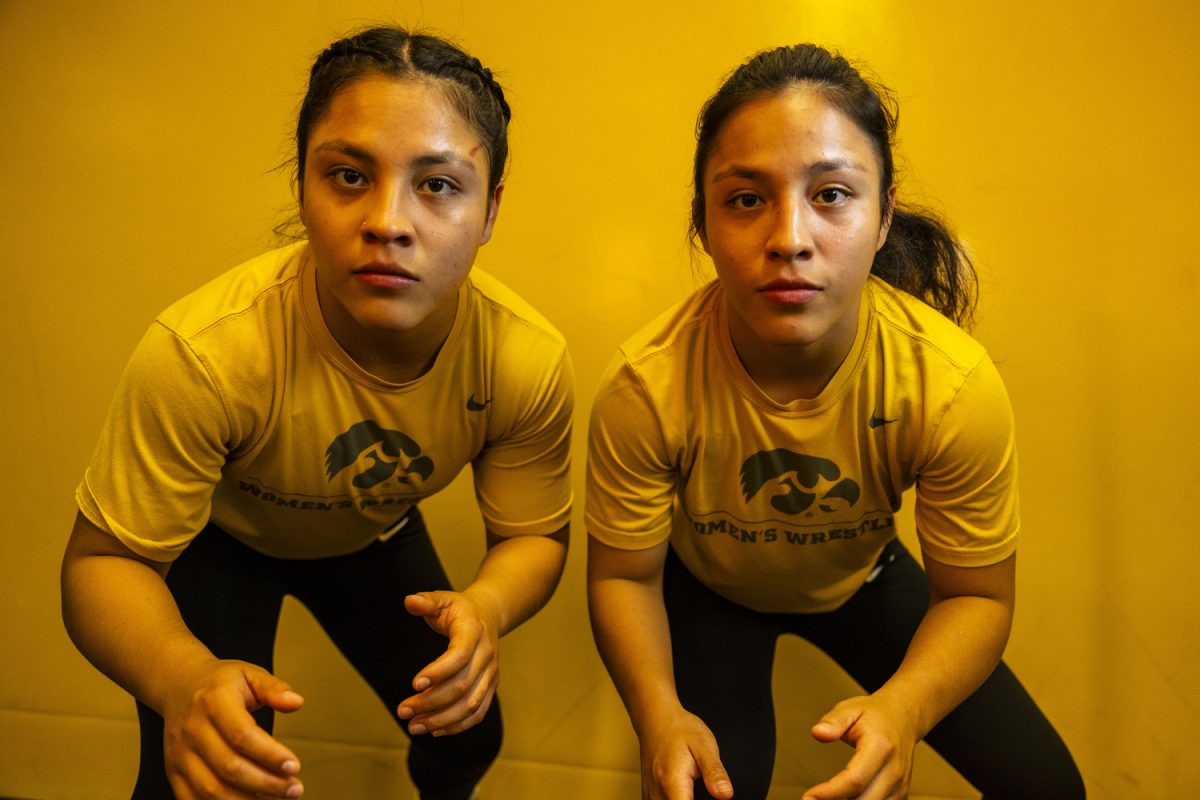 Sisters Brianna and Emilie Gonzalez pose for a portrait during the inaugural Iowa women’s wrestling media day in the Feller Club Room and the Dan Gable Wrestling Complex at Carver-Hawkeye Arena on Wednesday, Oct. 16, 2023. The duo wrestled at Arroyo High School in their hometown of El Monte, California.