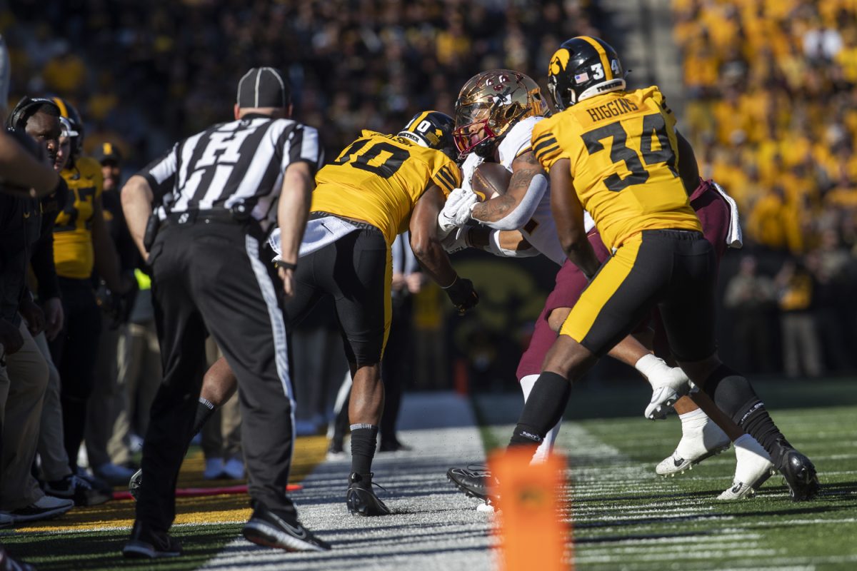 Minnesota running back Darius Taylor is pushed out of bounce during a football game between No. 24 Iowa and Minnesota at Kinnick Stadium in Iowa City on Saturday, Oct. 21, 2023. Taylor totaled 59 yards rushing and 25 yards receiving. The Golden Gophers defeated the Hawkeyes 12-10.