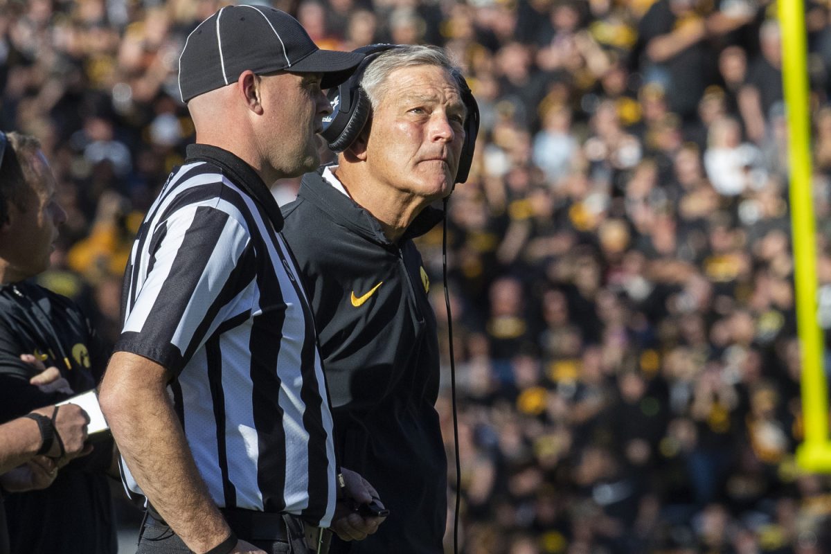 Iowa head Coach Kirk Ferentz talks to a referee while a play is reviewed during a football game between No. 24 Iowa and Minnesota at Kinnick Stadium in Iowa City on Saturday, Oct. 21, 2023. The Golden Gophers defeated the Hawkeyes 12-10.