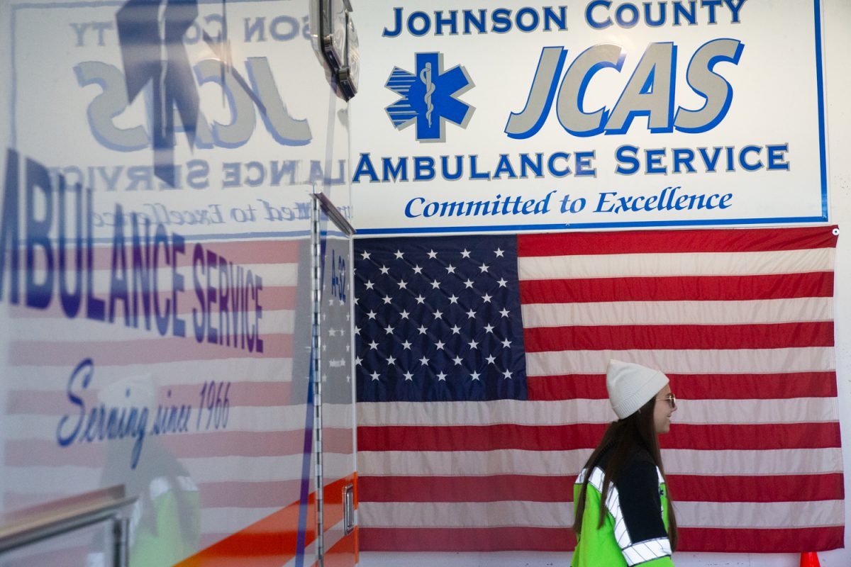 A Johnson County Ambulance Service worker laughs while walking towards a morning group huddle at the Johnson County Ambulance Medical Examiner Building on Saturday, Oct. 21, 2023. (Shuntaro Kawasaki/The Daily Iowan)
