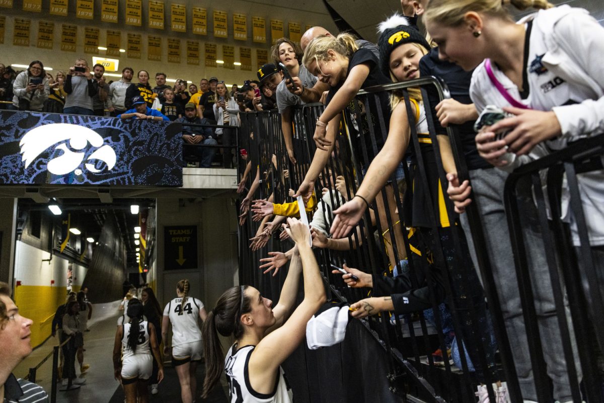 Iowa guard Caitlin Clark greets fans after an exhibition women’s basketball game between Iowa and Clarke University at Carver-Hawkeye Arena on Sunday, Oct. 22, 2023. The matchup marks Iowa’s first game in Carver-Hawkeye Arena for the 23-24 season. The Hawkeyes defeated the Pride, 122-49.