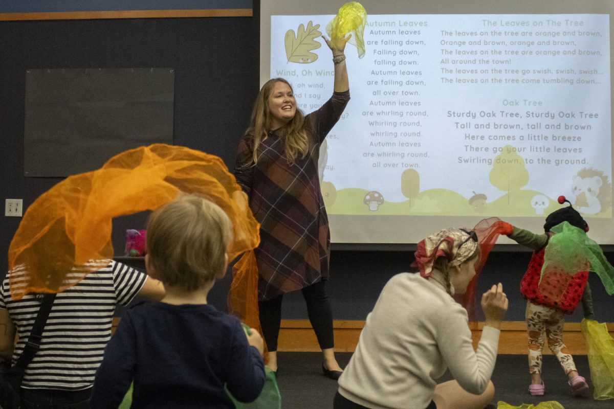 Librarian Angela Pilkington reads and dances with babies and toddlers at a “Book Babies” interactive reading activity on Tuesday, Oct 24, 2023. The event is every Tuesday in the Public Library’s Storytime Room. Angela Pilkington is a librarian at the Iowa City Public Library who recently won the 2023 Quality Time Award from the Iowa Library Association.