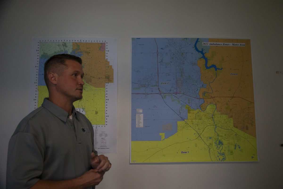 Johnson County Ambulance Service Assistant Director Ben Symonds showcases maps outlining the zone boundaries at the Johnson County Ambulance Medical Examiner Building on Wednesday, Sept. 27, 2023. The Johnson County Ambulance Service works with the University of Iowa Hospitals and Clinics on game day to manage the influx of people and emergencies in and around Kinnick. “I can tell you that especially in the earlier games, we have seen higher call volumes and some of those games where we have a lot of competition like with Iowa-ISU games or when Michigan comes in,” Symonds said. 