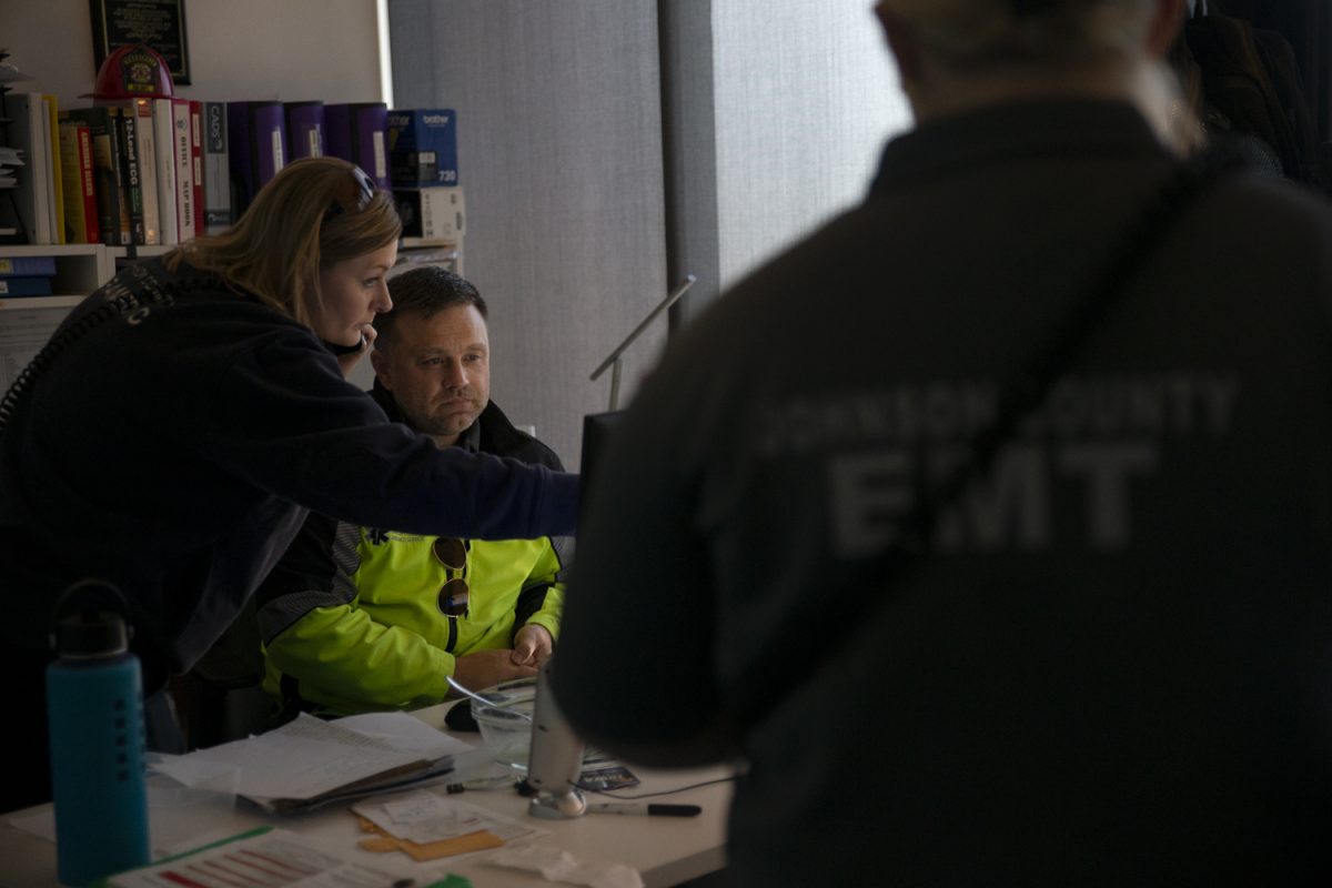 Paramedic Brandee Kleopfer calls and points to a computer screen at the Johnson County Ambulance Medical Examiner Building on Saturday, Oct. 21, 2023. 