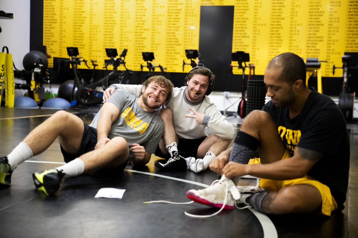 Iowa graduates 197-pound Jacob Warner and 125-pound Spencer Lee acknowledge the camera during the Iowa mens wrestling media day at Carver-Hawkeye Arena a Iowa on Thursday, Oct. 26, 2023.