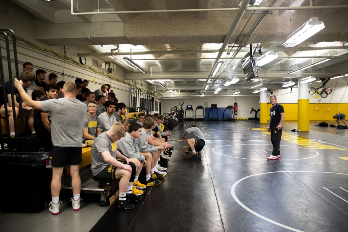 Iowa head coach Tom Brands prepares to talk to the wrestling team after Iowa mens wrestling media day at Carver-Hawkeye Arena on Thursday, Oct. 26, 2023.