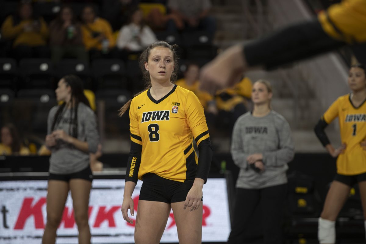 Iowa middle hitter Anna Davis listens to teammates during a volleyball match between Iowa and Rutgers at Xtream Arena on Friday Oct. 27, 2023. The Scarlet Knights defeated the Hawkeyes, 3-2. Davis transferred from Tulane in 2022, but was redshirted due to injury.