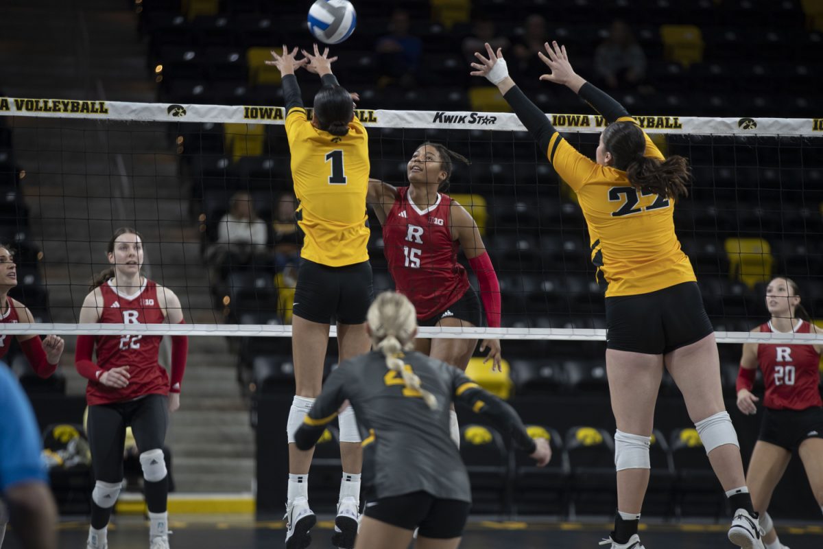 Rutgers middle blocker Zora Hardison attempts to hit a ball during a volleyball match between Iowa and Rutgers at Xtream Arena on Friday, Oct. 27, 2023. The Scarlet Knights defeated the Hawkeyes, 3-2.