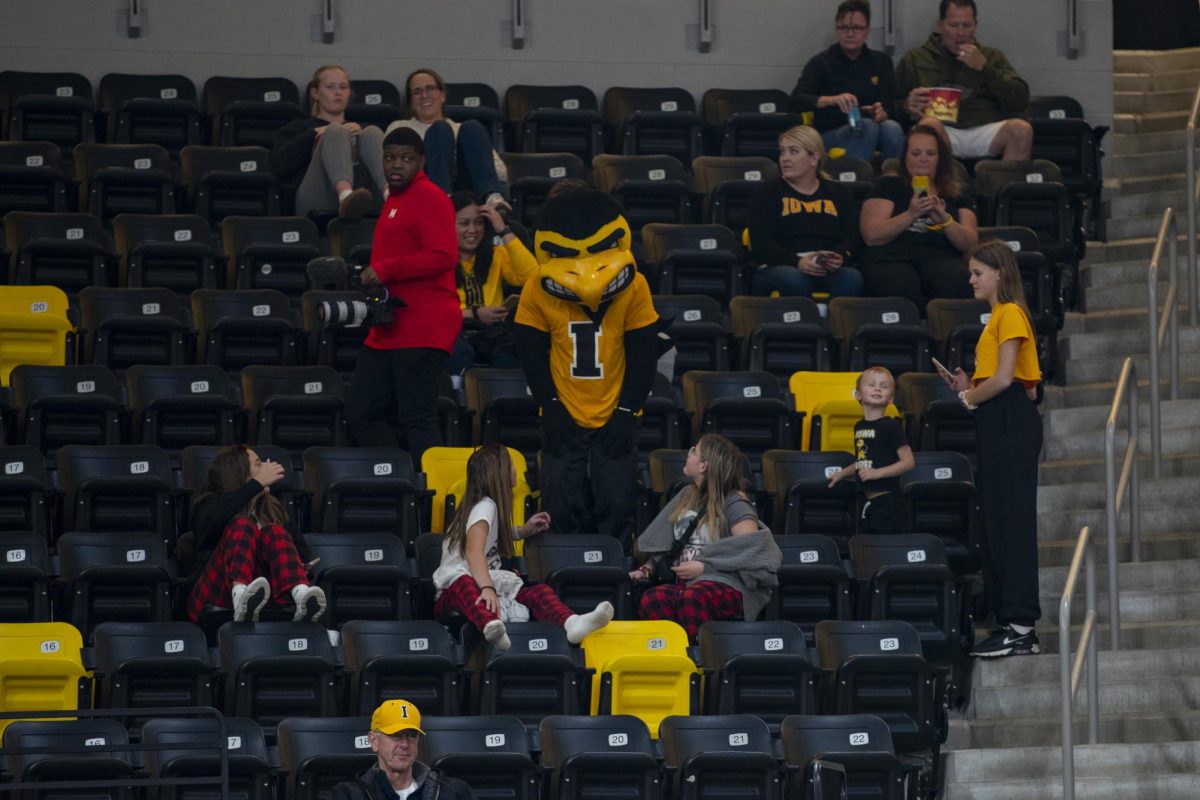 Herky the hawk talks to event-goers during a volleyball match between Maryland and Iowa at Xtream Arena in Coralville on Oct. 28, 2023. The Terrapins defeated the Hawkeyes 3-0. 