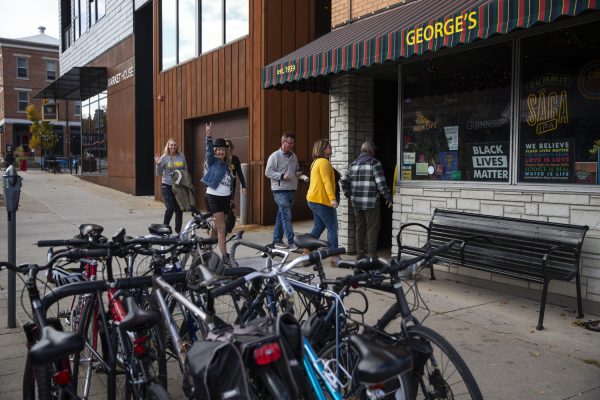 Attendees arrive at Georges in downtown Iowa City during the tenth annual Mark Lebeck bike ride and bar crawl in Iowa City on Saturday Oct. 28, 2023. 