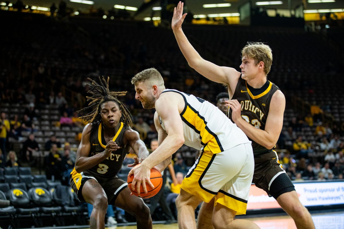 Iowa forward Ben Krikke prepares to go up for a shot during a men’s basketball game between Iowa and Quincy at Carver-Hawkeye Arena in Iowa City on Monday, Oct. 30, 2023. Krikke had 14 total points and 7 rebounds. The Hawkeyes defeated the Hawks, 103-76.