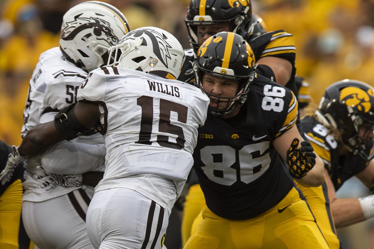 Iowa tight end Steven Stilianos blocks Western Michigan linebacker Donald Willis during a football game between No. 25 Iowa and Western Michigan at Kinnick Stadium on Sept. 16. The Hawkeyes defeated the broncos, 41-10.