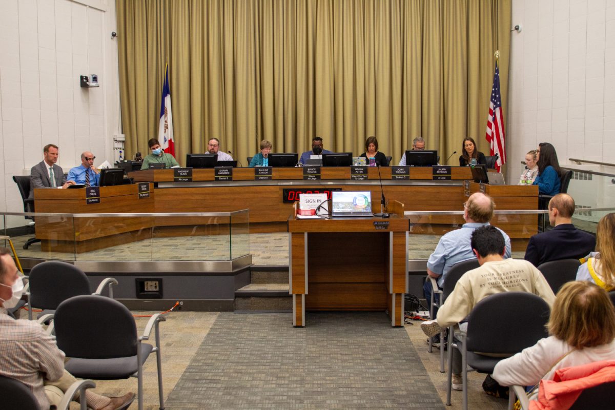 The Iowa City City Council sits at a panel during a meeting at City Hall on Tuesday, April 18, 2023. 