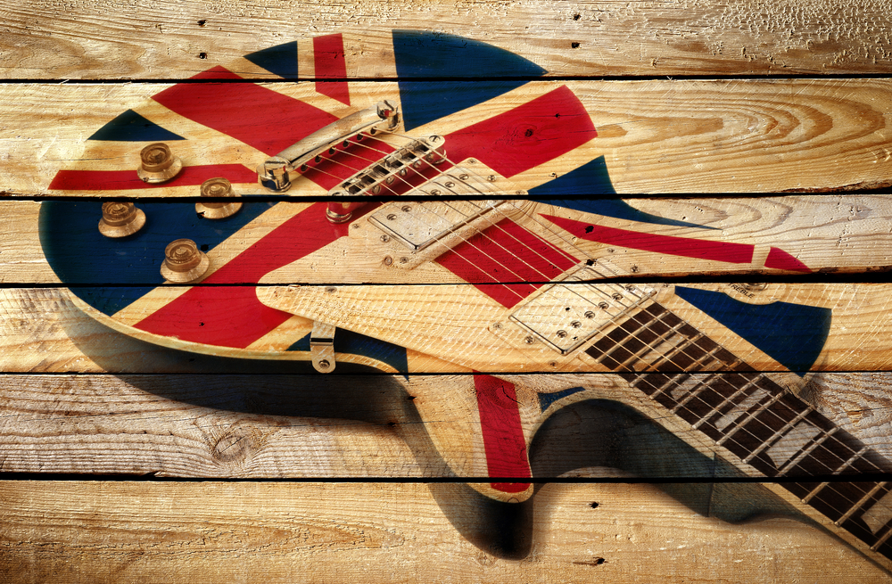 britsh electric guitar pinted onaged wood background