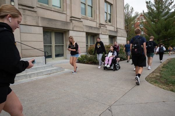 Ella Christopher is seen going to class with her personal care assistant Ashlyn on the Pentacrest at the University of Iowa on Sept. 21, 2023.
