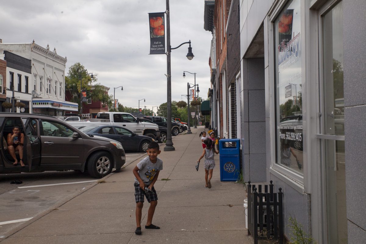 Kids play downtown in West Liberty, Iowa on Saturday, Sept. 23, 2023.