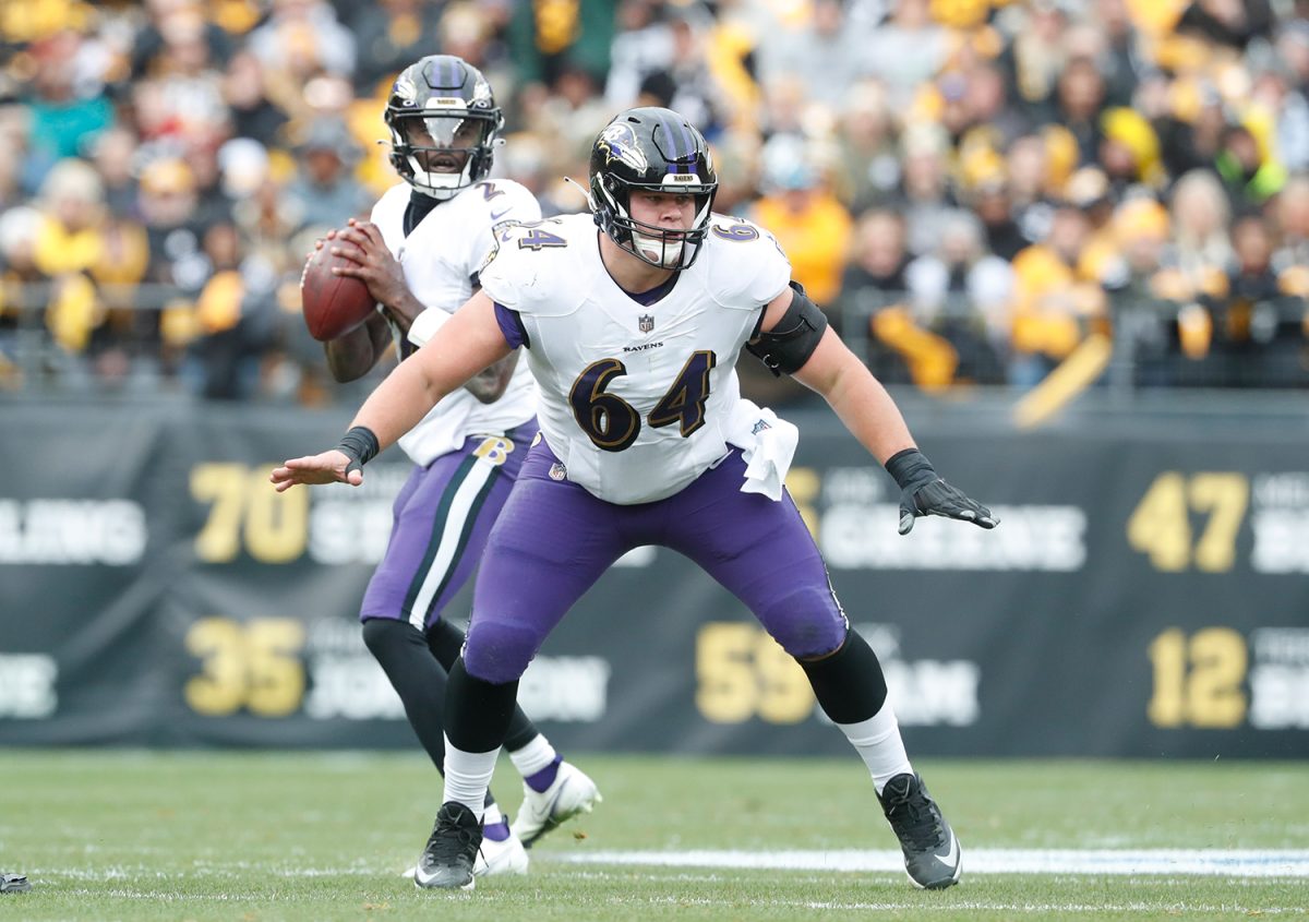 Dec 11, 2022; Pittsburgh, Pennsylvania, USA;  Baltimore Ravens center Tyler Linderbaum (64) in pass protection at the line of scrimmage against the Pittsburgh Steelers during the second quarter at Acrisure Stadium. Mandatory Credit: Charles LeClaire-USA TODAY Sports