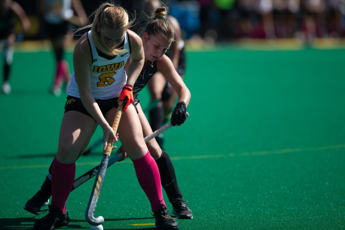 Iowas Miranda Jackson fends off an attacker to keep control of the ball during a field hockey game between Iowa and Michigan State on Sunday, Oct. 1, 2023. The Hawkeyes defeated the Spartans, 3-1. 