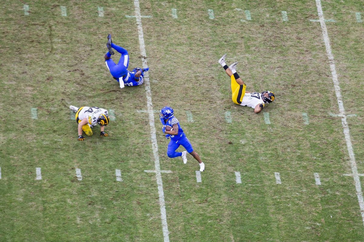 Kentucky wide receiver Tayvion Robinson runs the ball during the 2022 TransPerfect Music City Bowl at Nissan Stadium in Nashville on Saturday, Dec. 31, 2022. The Hawkeyes became the 2022 TransPerfect Music City Bowl champions after defeating the Wildcats, 21-0.