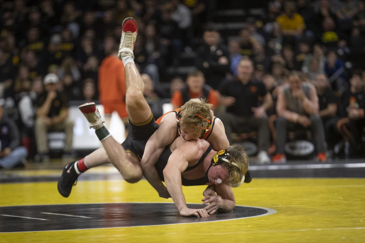 Iowa’s No. 10 149-pound Max Murin wrestles Oklahoma State’s No. 18 Victor Voinovich during a wrestling dual between No. 2 Iowa and No. 6 Oklahoma State in Carver-Hawkeye Arena on Sunday Feb. 19, 2023. Murin won by decision, 4-3. The Hawkeyes defeated the Cowboys, 28-7. 