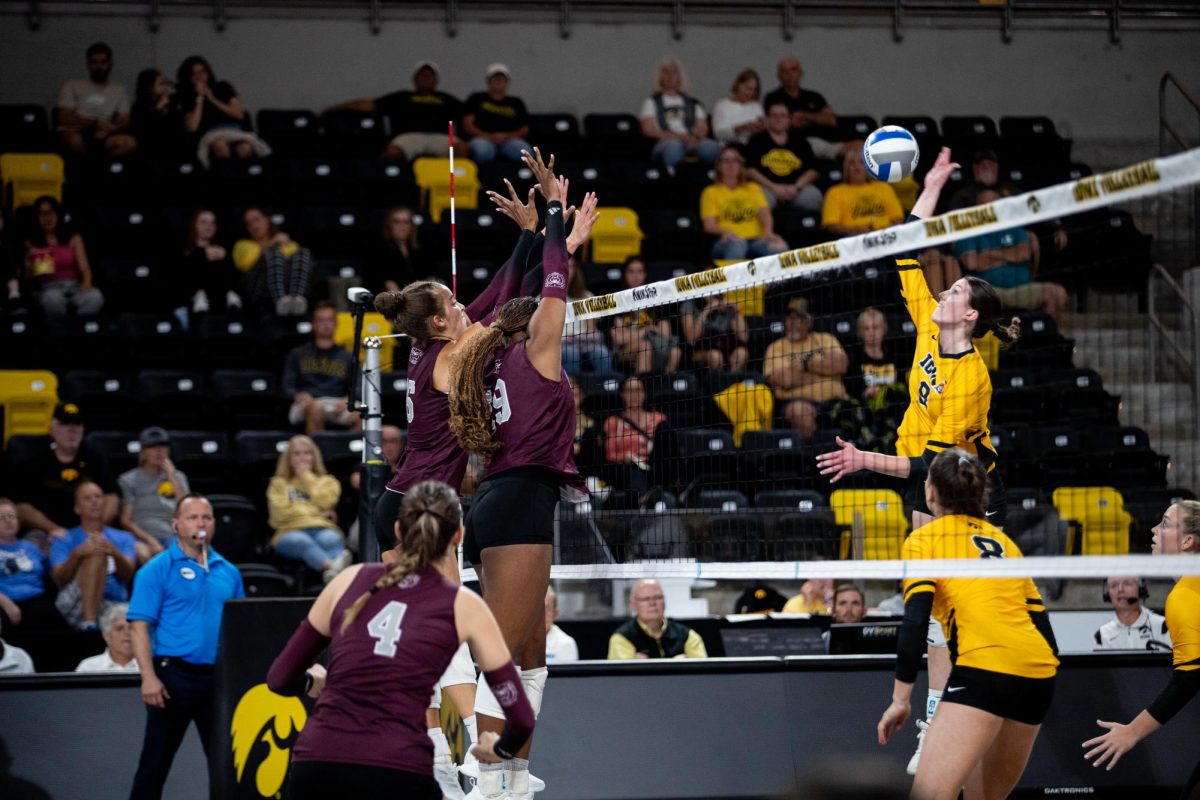 Missouri State’s outside hitter Breanah Rives and middle blocker Neele’ge’ Sims attempt to block the ball from Iowa’s outside hitter Gabby Deery during a volleyball game between Iowa and Missouri State on Saturday, Sept. 9, 2023. 
