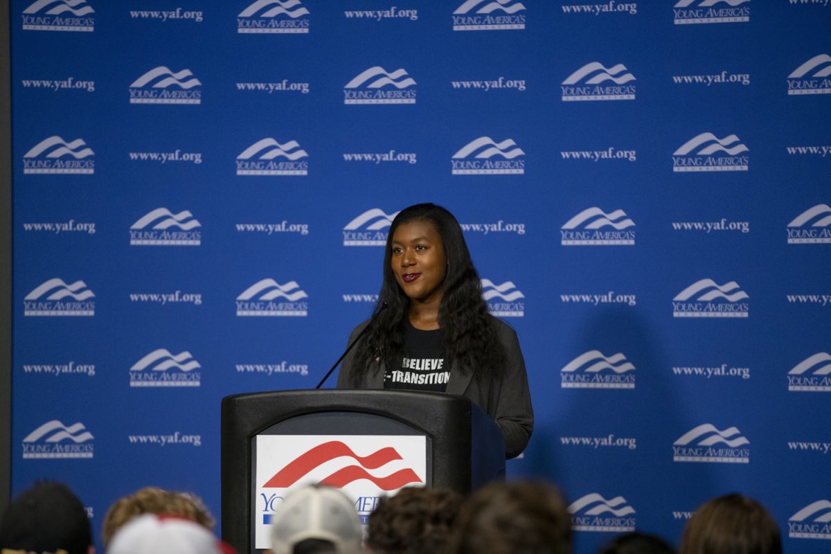 Young Americans for Freedom Chairwoman Jasmyn Jordan opens lecture during a Young Americans for Freedom hosted event about Chloe Cole, an activist, in the Iowa Memorial Unions Blackbox Theather in lowa City on Monday, Oct. 16, 2023. Pro-Transgender activists protested outside the IMU and later blocked the North Madison Street and West Jefferson Street intersection. The protest concluded with protests in front of University of lowa president Barbara Wilsons residence on Church St. 