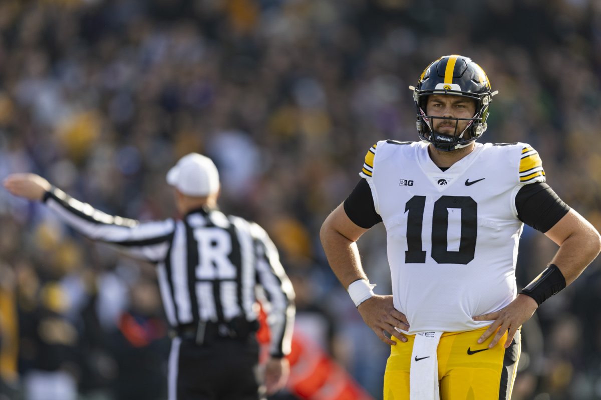 Iowa quarterback Deacon Hill looks towards the sidelines during the 2023 Wildcats Classic, a football game between Iowa and Northwestern at Wrigley Field in Chicago, on Saturday, Nov. 4, 2023. Hill passed for 65 yards and a touchdown. The Hawkeyes defeated the Wildcats, 10-7.
