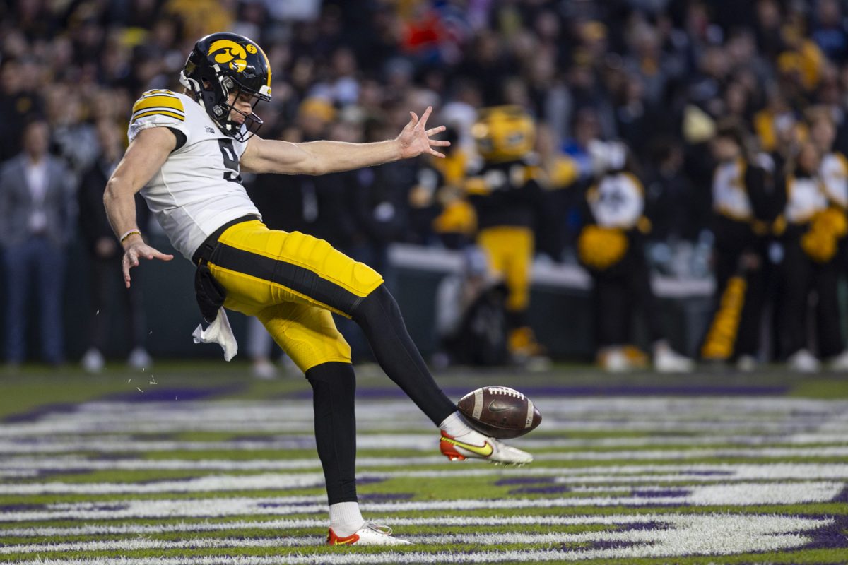 Iowa punter Tory Taylor punts the ball during the 2023 Wildcats Classic, a football game between Iowa and Northwestern at Wrigley Field in Chicago, on Saturday, Nov. 4, 2023. Taylor had six punts compared to Northwestern’s eight punts during the game. The Hawkeyes defeated the Wildcats, 10-7.