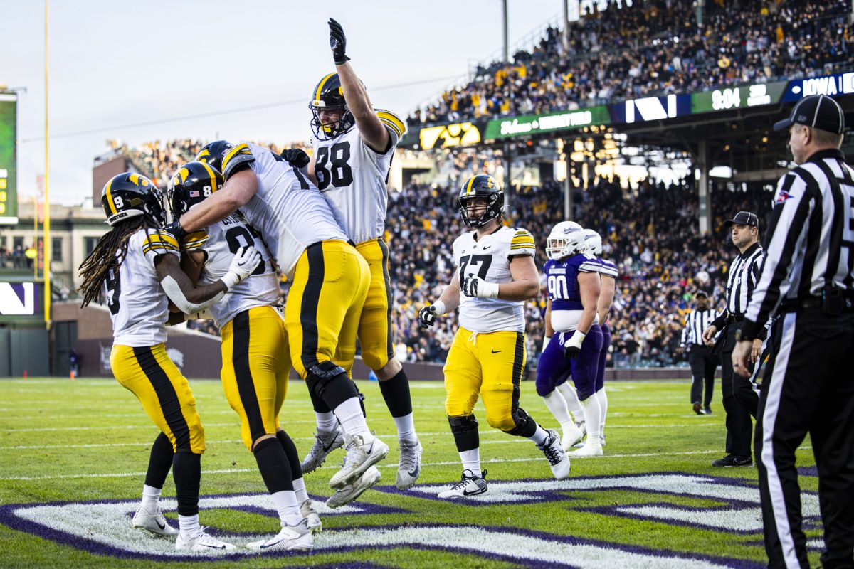 Iowa celebrates a touchdown by Iowa tight end Addison Ostrenga during the 2023 Wildcats Classic, a football game between Iowa and Northwestern at Wrigley Field in Chicago on Saturday, Nov. 4, 2023. Iowa had a total of 65 receiving yards. The Hawkeyes defeated the Wildcats, 10-7.