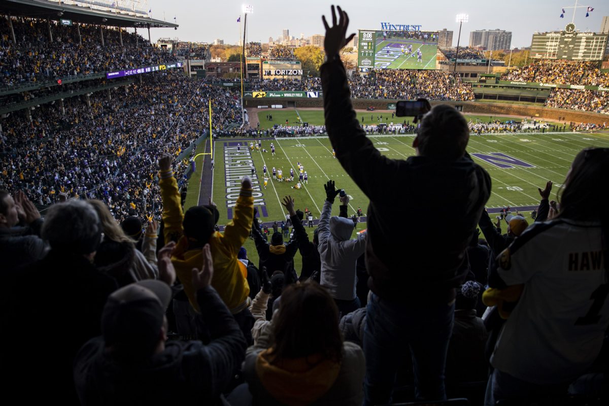 Fans celebrate after Iowa tight end Addison Ostrenga scored a touchdown during the 2023 Wildcats Classic, a football game between Iowa and Northwestern at Wrigley Field in Chicago, on Saturday, Nov. 4, 2023. Iowa had ten receptions on the day. The Hawkeyes defeated the Wildcats, 10-7.