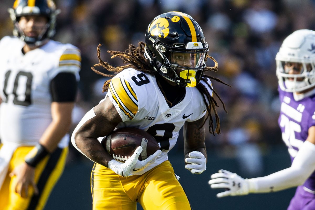 Iowa running back Jaziun Patterson carries the ball during the 2023 Wildcats Classic, a football game between Iowa and Northwestern at Wrigley Field in Chicago on Saturday, Nov. 4, 2023. Patterson carried the ball eight times averaging 2.6 yards. The Hawkeyes defeated the Wildcats, 10-7.